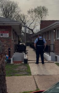 Photo of officer at condemned apartments